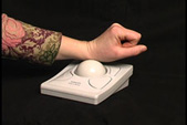 Users roll the large ball on a trackball mouse to move the mouse pointer on screen